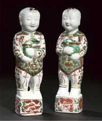 17th Century A pair of famille verte models of smiling boys